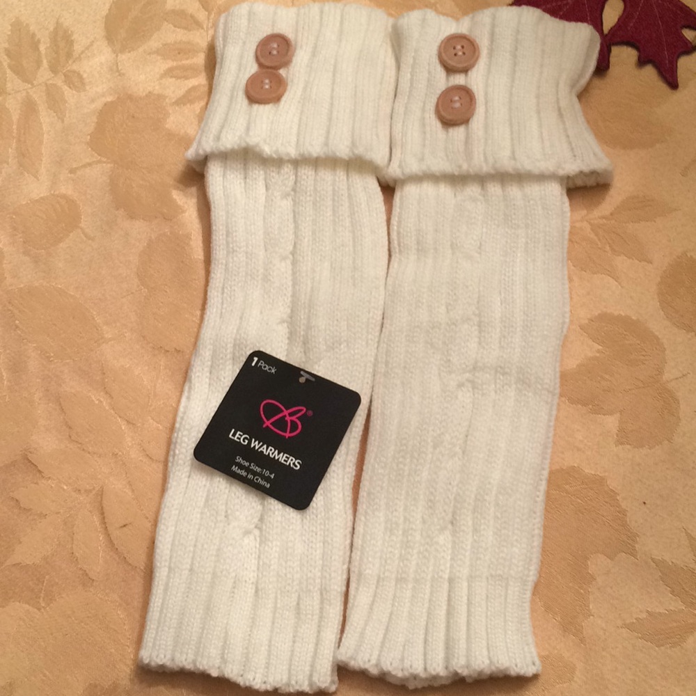 White knit leg warmers with button top.